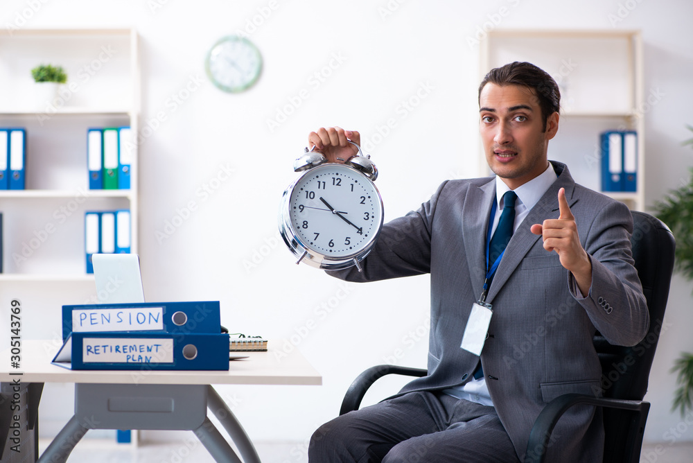 Young male accountant working in the office Young male accountant working in the office