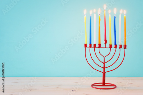 Religion image of jewish holiday Hanukkah background with menorah (traditional candelabra) and candles