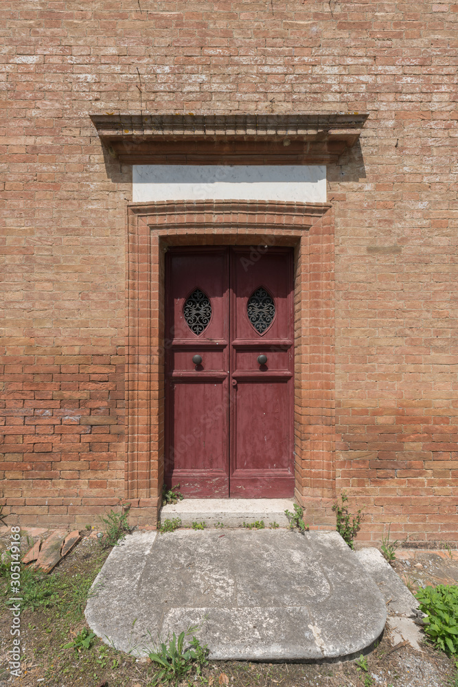 Ancient red wood door and brick walls Ancient red wood door and brick walls