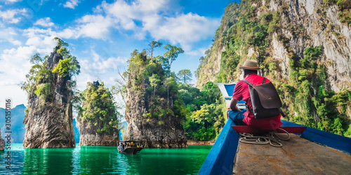 Panorama man traveler on boat joy nature rock mountain island scenic landscape Khao Sok National park, Famous travel adventure place Thailand, Tourism beautiful destinations Asia holiday vacation trip © day2505