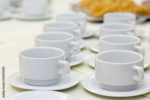 White cups on a coffee break table