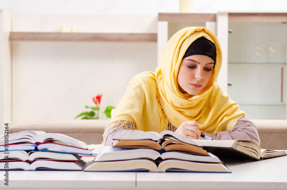 Female student in hijab preparing for exams