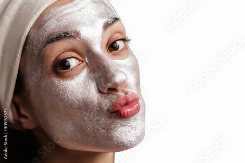 Young brunette with brown eyes in modeling face mask photo