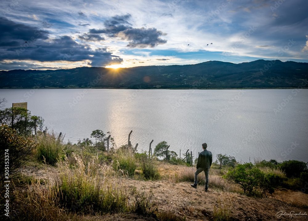 man admiring the sunset