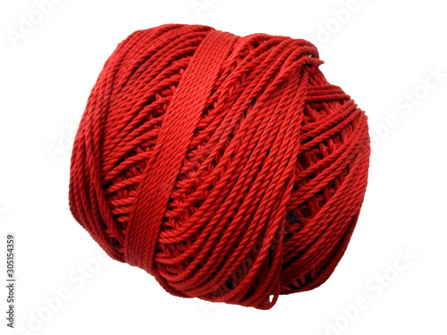 Red knitting yarn for handicrafts isolated on white background. Background of wool yarn, knitted yarn, can also be used as a yarn frame.