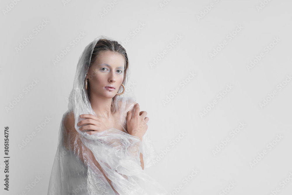 Beautiful woman with creative makeup on white background Beautiful woman with creative makeup on white background
