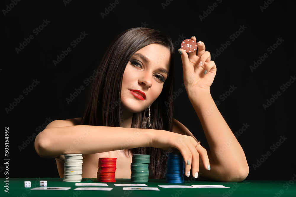 Female poker player at table in casino Female poker player at table in casino