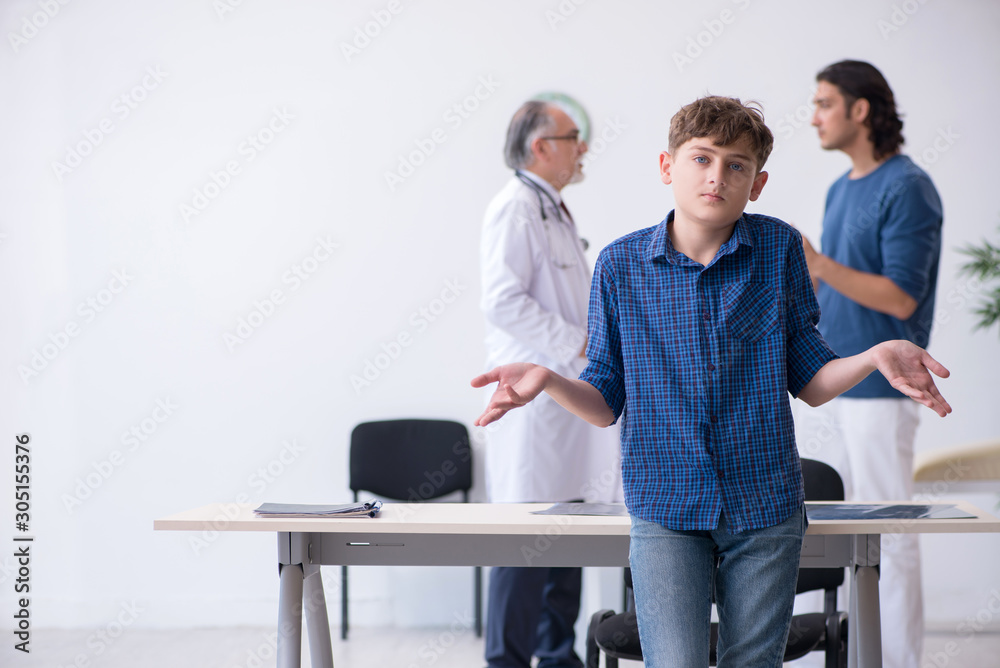 Young boy visiting doctor in hospital