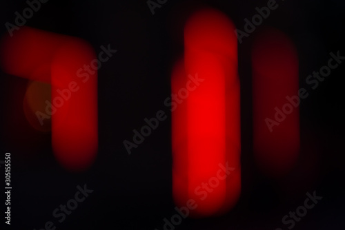 Red abstract stripes on black background texture overlay.  Background with bokeh.