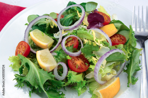 salad and raw vegetables on a plate