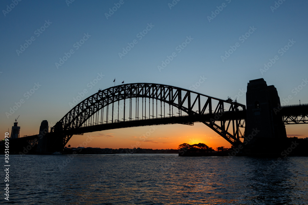 Silhouette of Sydney Harbour Bridge viewed from Kirribilli at sunset