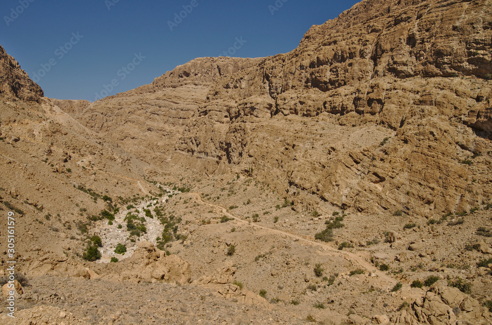 Scenic mountain road in rocky landscape of Sultanate of Oman