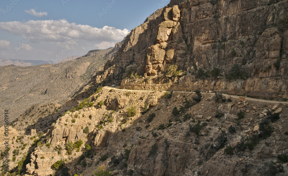Fototapeta premium Scenic mountain road in rocky landscape of Sultanate of Oman
