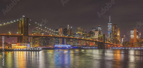 Panorama scene of New york Cityscape with Brooklyn Bridge over the east river at the twilight time, USA downtown skyline, Architecture and building with tourist concept © THANANIT