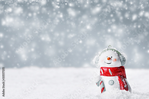 Snowman toy on winter background © yellowj