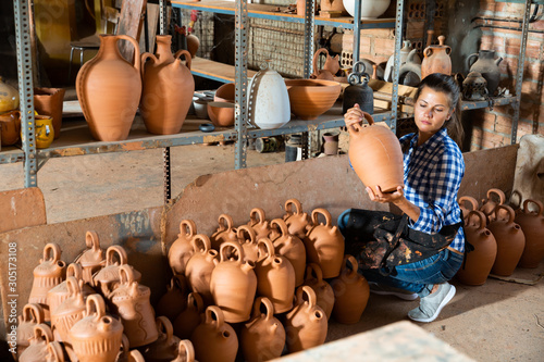 Female potter in pottery studio