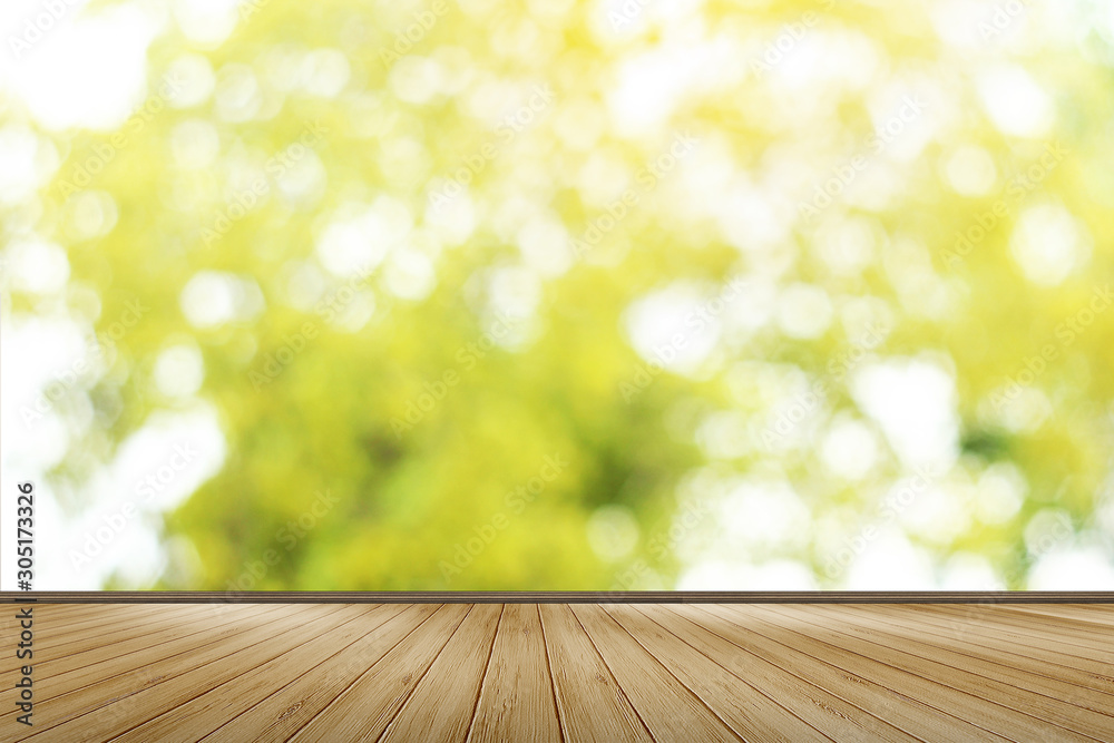 Wood floor for space use area have blur background green leaves
