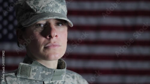 American female soldier against an American flag