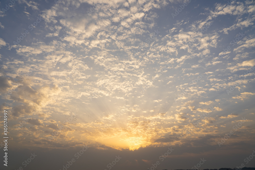 View of sky with sun rise beside ganga river.
