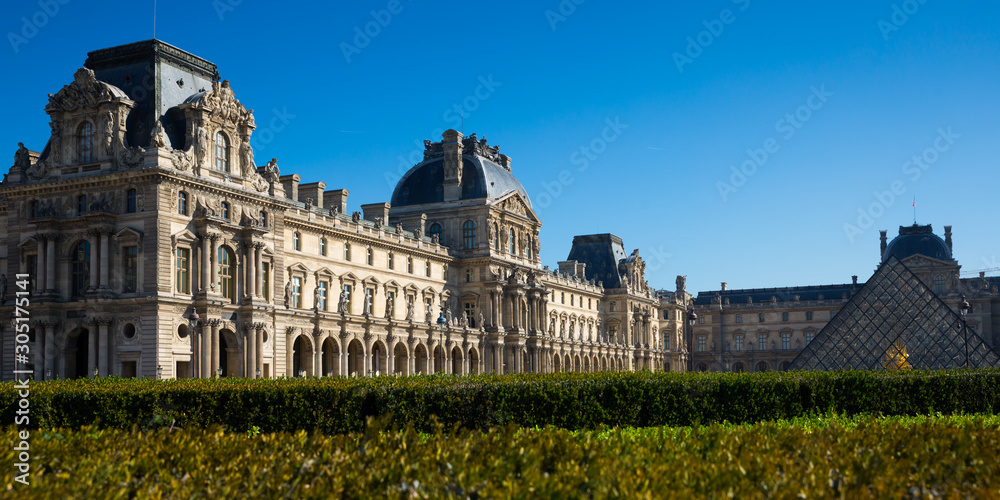 Panorama of Louvre Palace courtyard with pyramid
