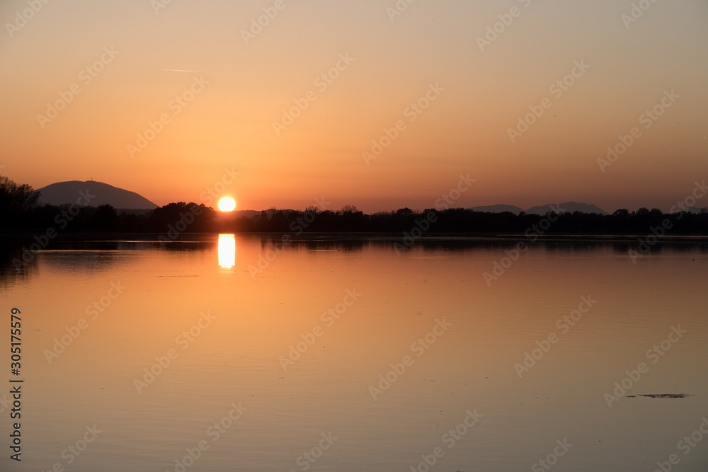 sunset over the ptujsko jezero dam on drava river in Ptuj in Slovenia