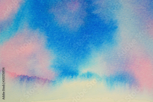 Watercolor background. Stains and flow of flowers. A mixture of blue, cyan and pink.