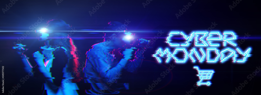 Man and woman in virtual reality glasses on black background with blue inscription.