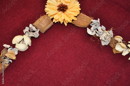 Fall decoration dried trinkets and diy frame on bordoux surface