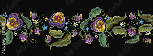 Violets flowers, horizontal seamless pattern. Embroidery art. Summer garden style. Fashionable design of clothes, textile