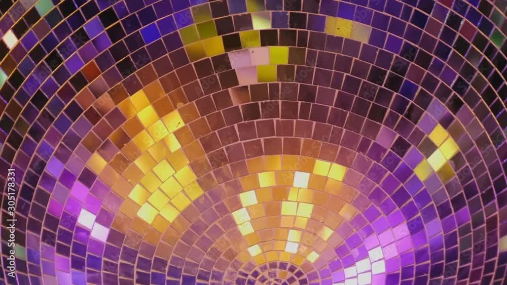 Rotating mirror disco ball, extreme close-up. Dancing or party concepts