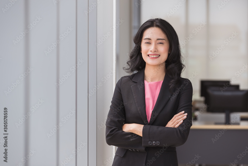 Businesswoman standing and crossed her arms.. Businesswoman standing and crossed her arms..