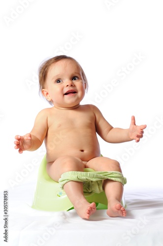 Potty training of adorable baby photo