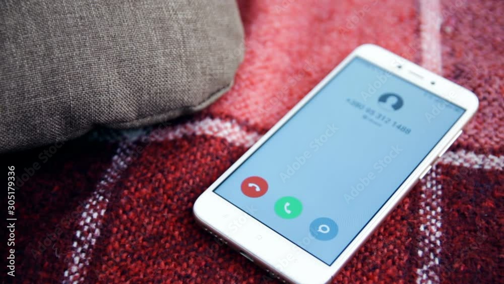 Call on mobile phone lying on sofa