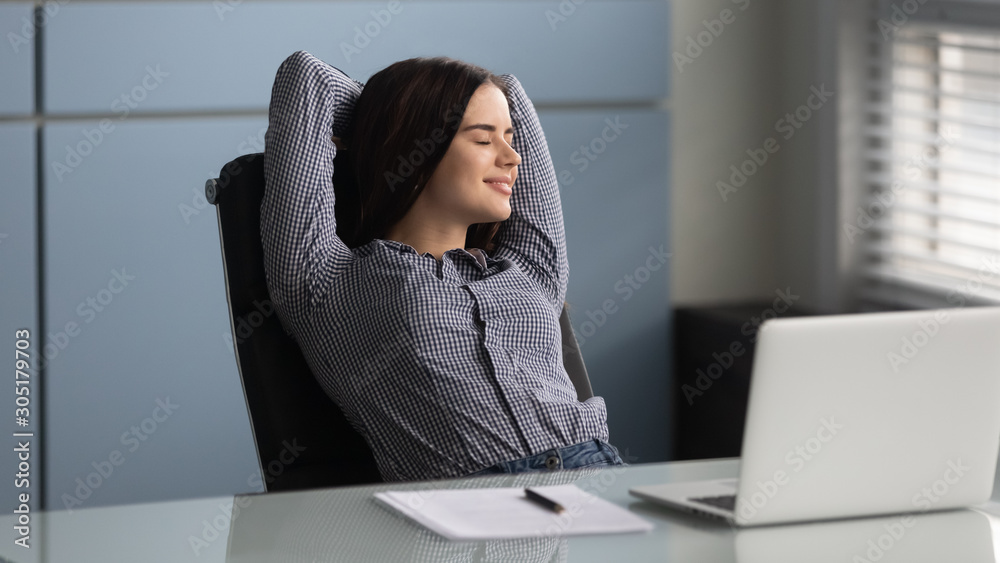 Happy female worker relax at workplace with eyes closed - obrazy, fototapety, plakaty 