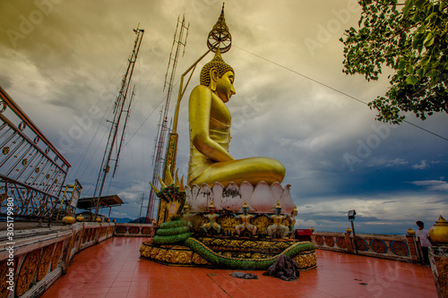 Background Large Buddha statues built on high mountains in Thailand  Wat Tham Sua   people and tourists come to visit the beauty and make merit always in Krabi.