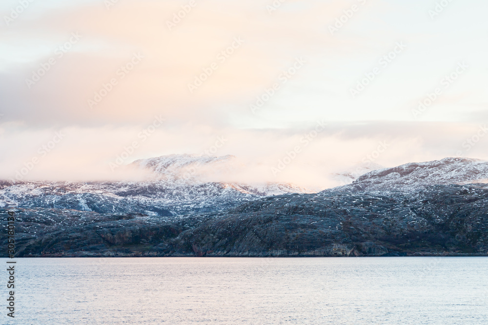 A Winter View Of The Rocky Coastline Close To The Norwegian Town Of Kirkenes
