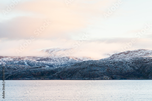 A Winter View Of The Rocky Coastline Close To The Norwegian Town Of Kirkenes