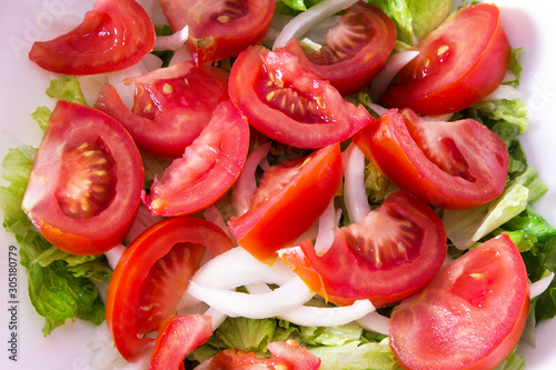 bowl with lettuce and tomato salad, diet and food concept
