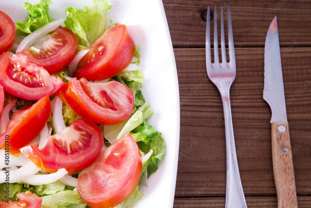 lettuce and tomato salad, diet and food concept lettuce and tomato salad, diet and food concept