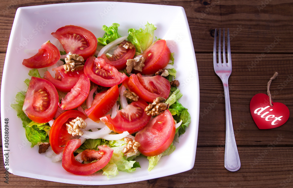 lettuce and tomato salad, diet and food concept lettuce and tomato salad, diet and food concept