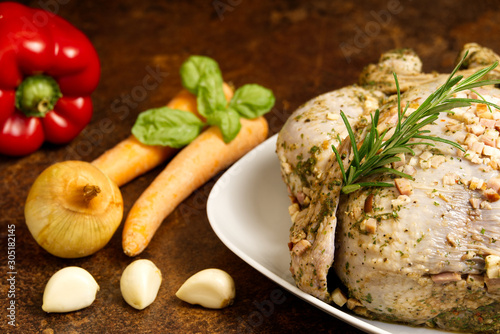 Pickled chicken with vegetables. Marinated grill a hen with carrots, peppers, onions, basil and rosemary.