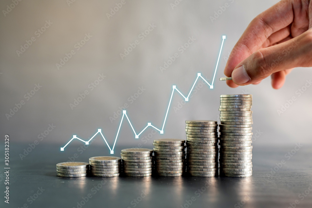 Hand stacking coins on black wooden table with profit line chart growth up. Business, finance, marketing, e-commerce concept and design - obrazy, fototapety, plakaty 