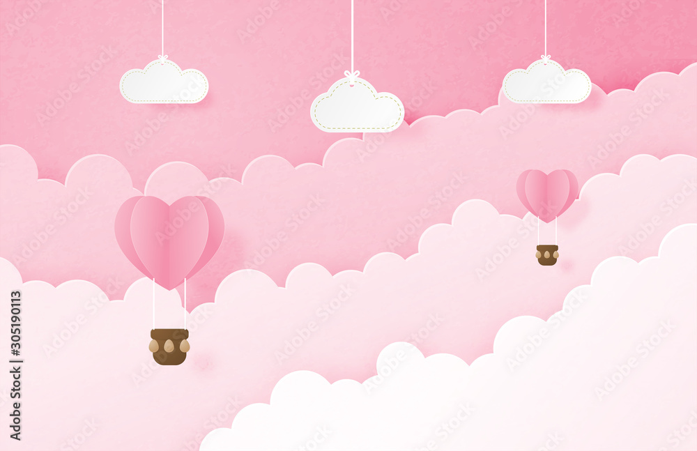 Valentine's day banner with heart shape hot air balloon floating in the sky and hanging clouds in paper cut style. Digital craft paper art concept.