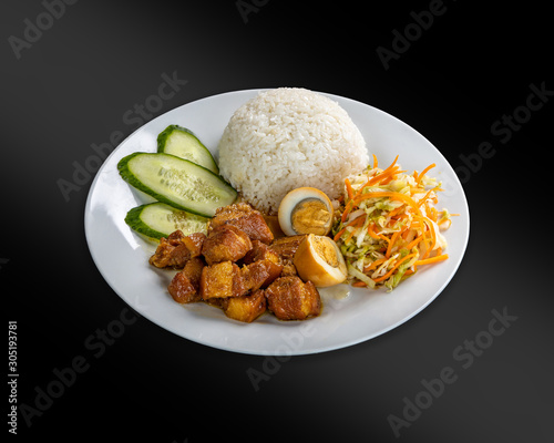 Thit Kho - pork stewed in caramel sauce with boiled egg.