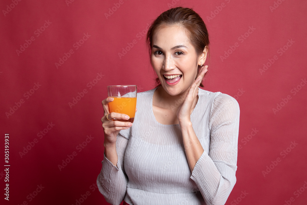 Happy Young Asian woman drink orange juice. Happy Young Asian woman drink orange juice.