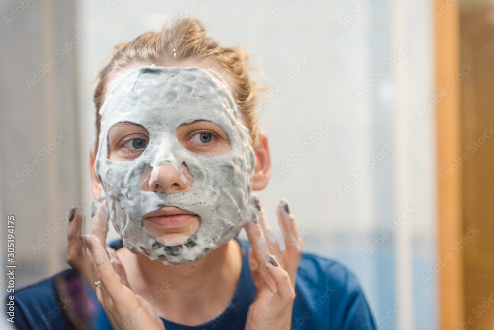 facial cleansing mask. Girl Wearing A Face Mask. lady's beauty. face cleaning at home. facial at home. foamy face mask. facial cleansing mask. Girl Wearing A Face Mask. lady's beauty. face cleaning at home. facial at home. foamy face mask.