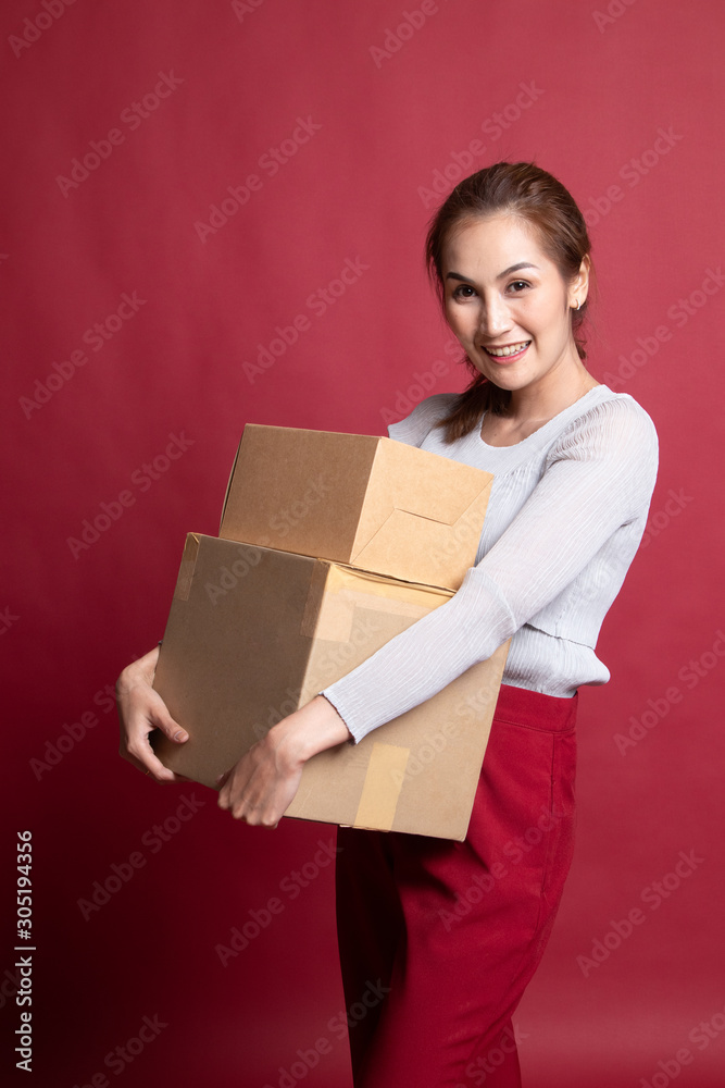 Delivery, relocation and unpacking. young asian woman holding cardboard box. Delivery, relocation and unpacking. young asian woman holding cardboard box.