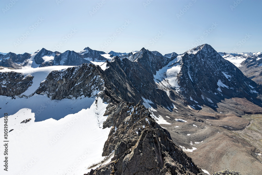 Wild alpine landscape with snow, glaciers and rocky mountains at a sunny day in the Stubai Alps (Tirol, Austria).
