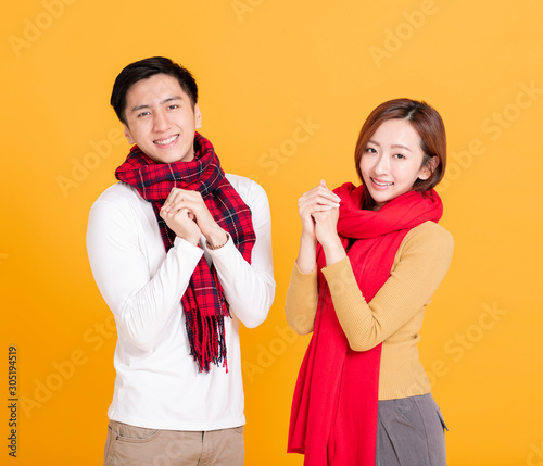 happy asian young couple celebrating chinese new year