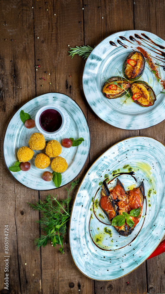 hot snacks: baked zucchini, young fried cheese, baked eggplant with napoli sauce and parmesan hot snacks: baked zucchini, young fried cheese, baked eggplant with napoli sauce and parmesan
